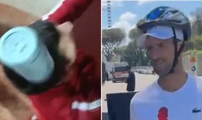 Italian Open: Novak Djokovic wears cycling helmet to sign autographs after being struck on head