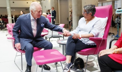 King Charles holds hands with cancer patients as he returns to public duties after own diagnosis