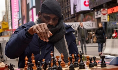 Chess champion plays for marathon 6 hours to break record - and raise cash for child education