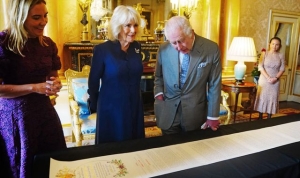 King praises artists who worked on Coronation document, telling them: &#039;You deserve a very stiff drink&#039;