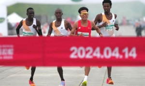 Beijing half marathon winner loses medal after competitors slowed down to let him win