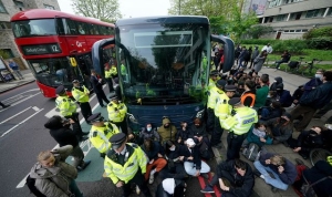 Bibby Stockholm: Protesters block coach as they try to stop asylum seekers being moved to barge
